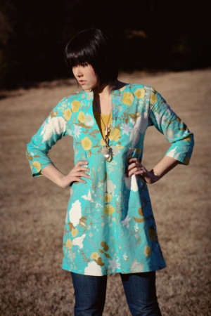 A blue floral schoolhouse tunic worn over a yellow tank and jeans