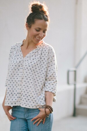 Meg wears a Matcha Top sewing pattern in a white and blue ikat fabric.