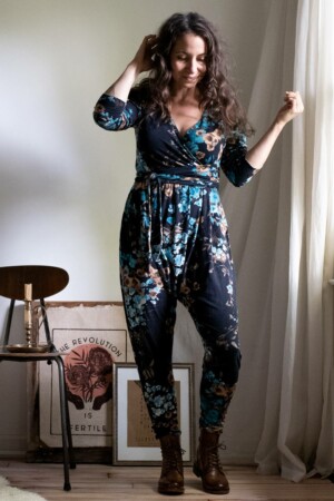 Meg wears a dark floral knit Talam Jumpsuit sewing pattern.