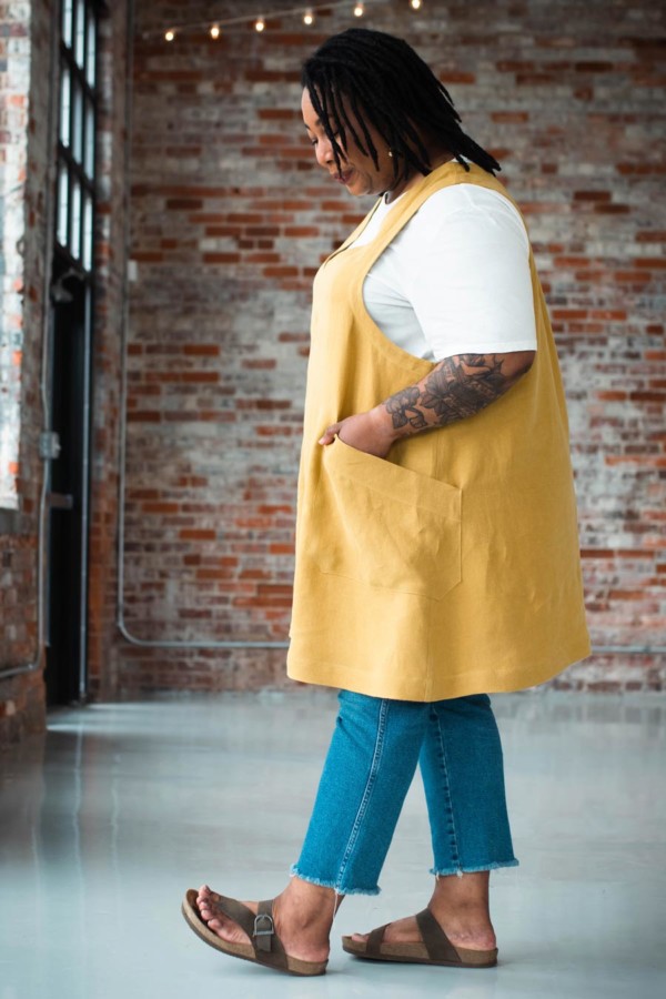 Ashley showing the side of her amber-colored Studio Tunic.