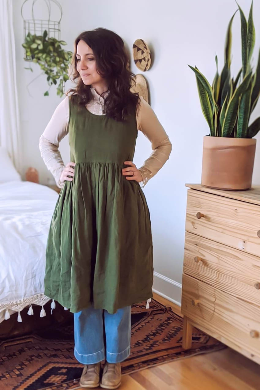 Meg wears a green Hinterland dress.