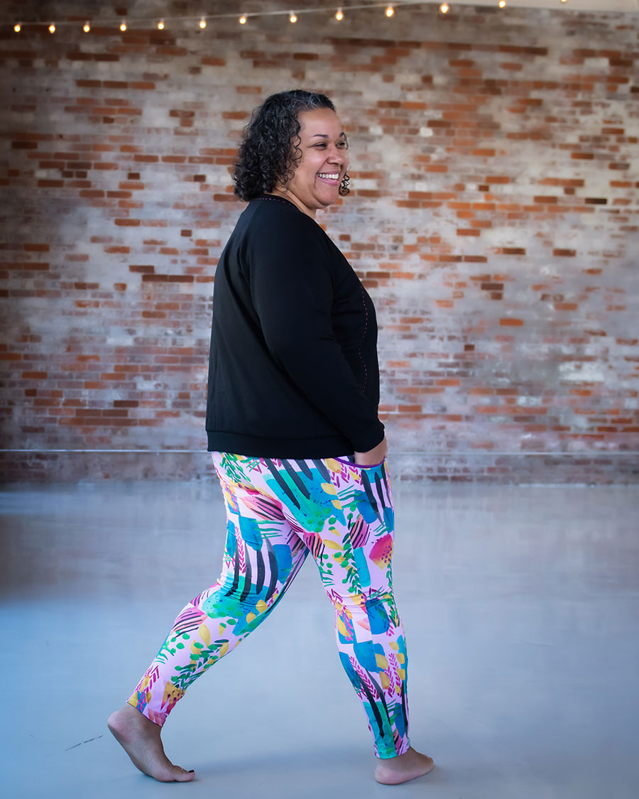 Sudilaura wears Spoonflower performance knit Limestone leggings she designed. She paired them with a Nest Sweatshirt.
