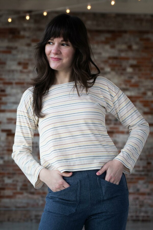 Meredith shows the front of her striped Bedrock Tee.