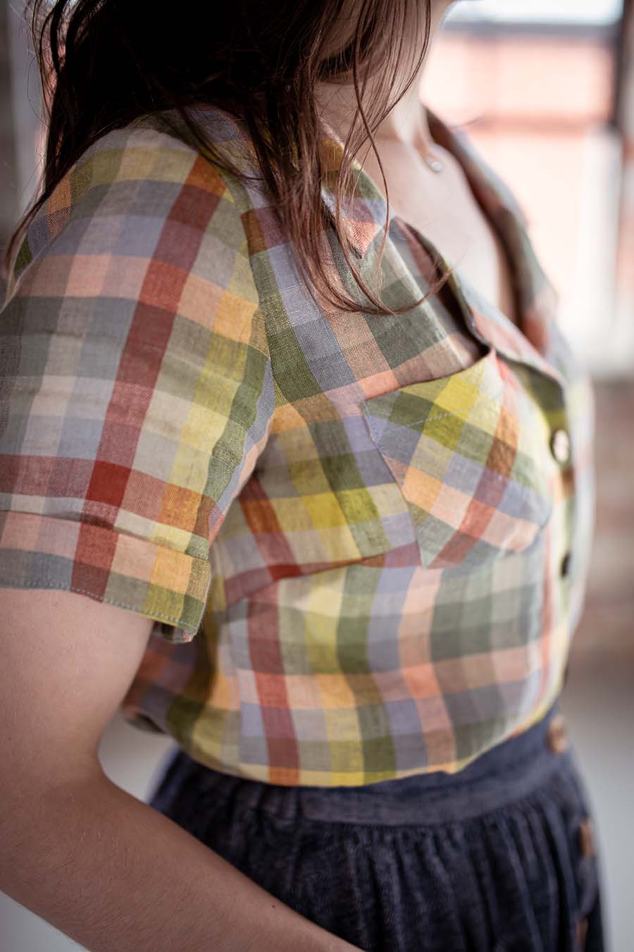 Meredith wearing a pastel plaid view a joanie top